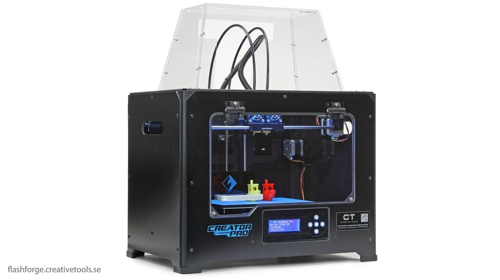 Flashforge Creator Pro with a closed metal frame, front window and clear lid around the build area